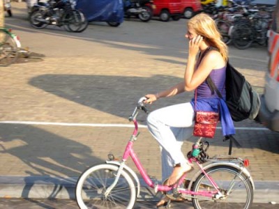 Female Cyclist Using Cell Phone