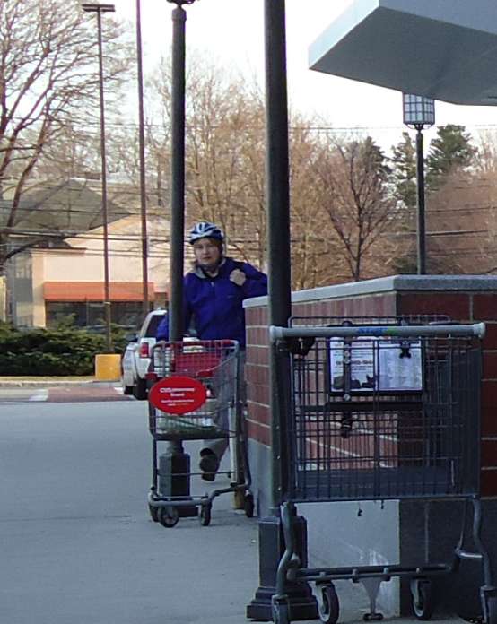 Cyclist Exiting Store