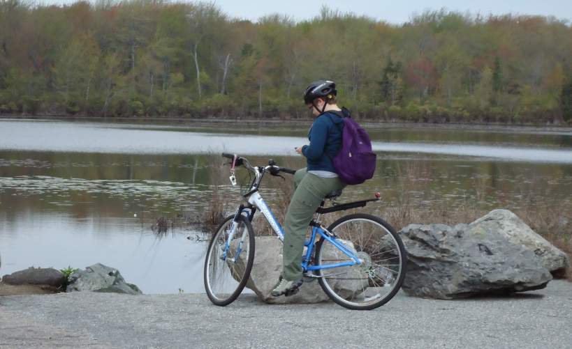 Cyclist Resting With Bike