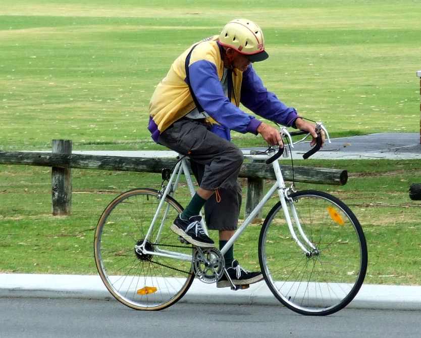 Elder Riding A Bicycle