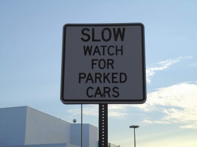 Slow Watch For Parked Cars Sign