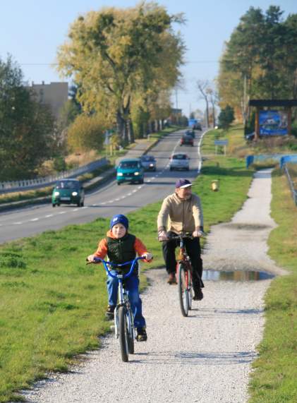 Man And Boy Riding Bikes