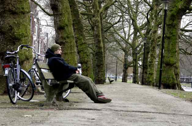 Man Sitting Near Bikes